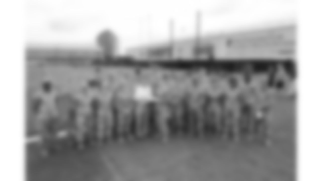Kansas City Chiefs Chairman, CEO, and Owner Clark Hunt presents a ball service members of the Whiteman U.S. Air Force base during day 1 of the Kansas City Chiefs Season Ticket Member First Look Event on Tuesday June 17, 2025 in Kansas City, MO.