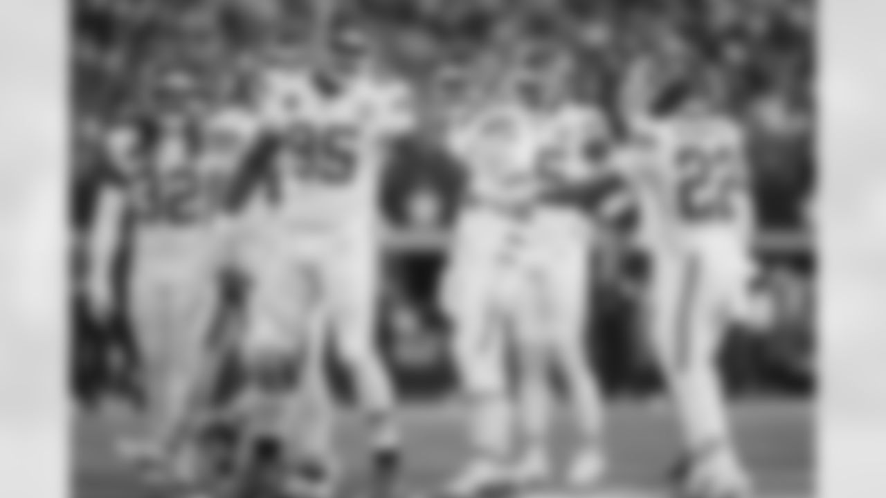 Kansas City Chiefs defensive tackle Chris Jones (95) and Kansas City Chiefs cornerback Trent McDuffie (22) fist bump during a week 13 NFL football game against the Dallas Cowboys on Thursday, November 27, 2025 in Arlington, TX.