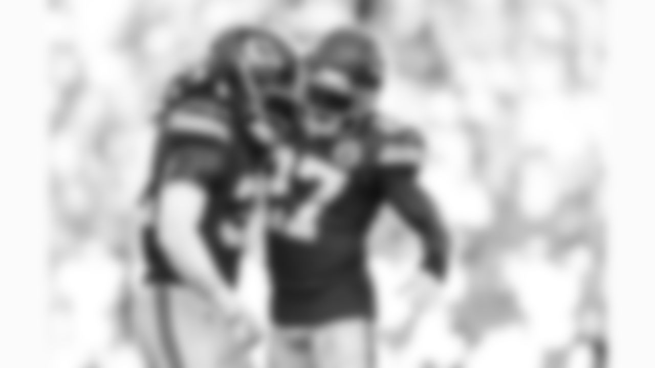 Kansas City Chiefs linebacker Nick Bolton (32) and defensive back Chamarri Conner (27) celebrate during the week 4 NFL football game against the Baltimore Ravens, Sunday, September 28, 2025 in Kansas City, MO.