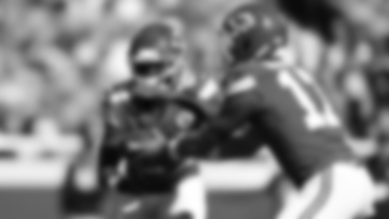 Running back Brashard Smith (24) takes a handoff from Kansas City Chiefs quarterback Gardner Minshew (17) during a week 7 NFL Football game against the Las Vegas Raiders on Sunday, October 19, 2025 in Kansas City, MO.