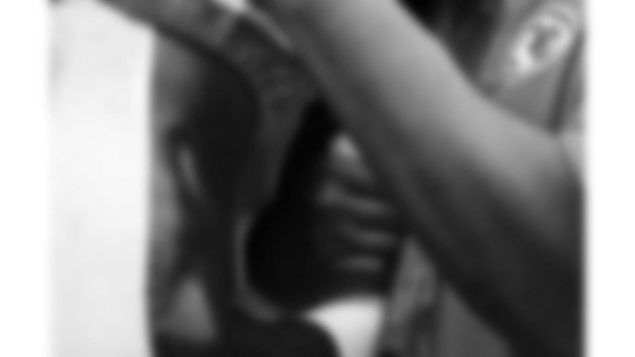 Team Chaplain Marcellus Casey holds the hand of a Kansas City Chiefs player in prayer prior to the week 2 NFL football game against the Philadelphia Eagles, Sunday, September 14, 2025 in Kansas City, MO.