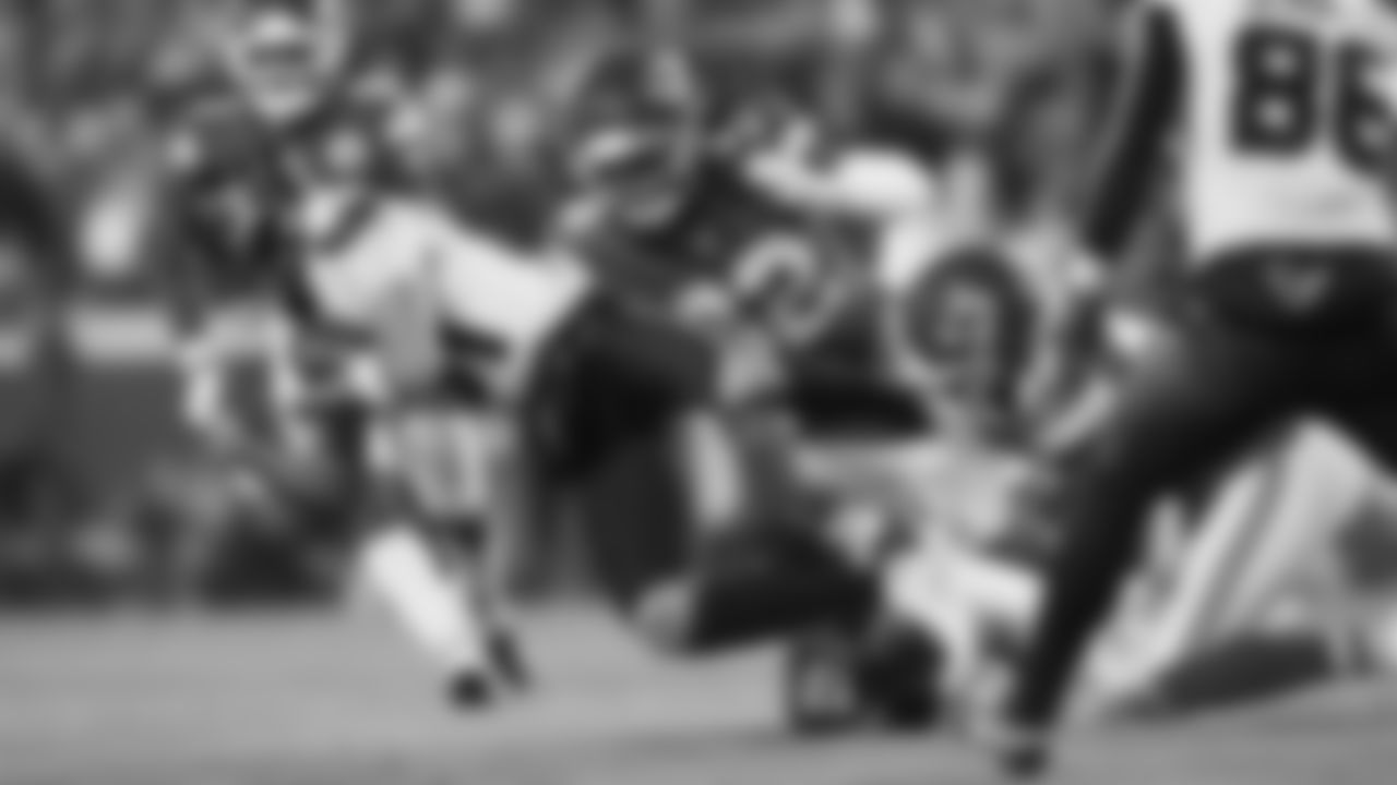 Linebacker Nick Bolton (32), defensive back Chamarri Conner (27), and Kansas City Chiefs defensive back Jaden Hicks (21) make a tackle during an NFL week 14 matchup against the Houston Texans, Sunday December 7, 2025.