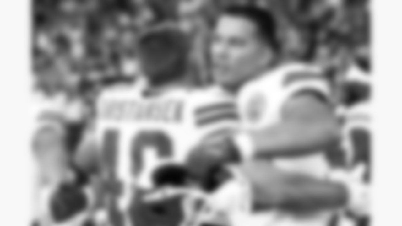 Kansas City Chiefs linebackers Cole Christiansen (48) and Brandon George (50) hug prior to a preseason week 1 NFL football game against the Arizona Cardinals, Saturday, August 9, 2025 in Glendale, AZ.