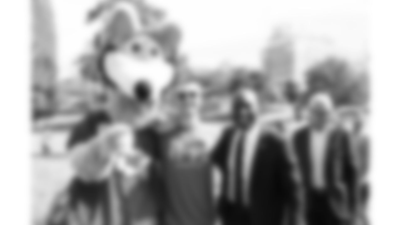 KC Wolf with Braden of Bradens Hope and Mayor Quinton Lucas at the Hero Parade and Fountain Dyeing event on Friday, August 29, 2025 at Mill Creek Park in Kansas City, MO.