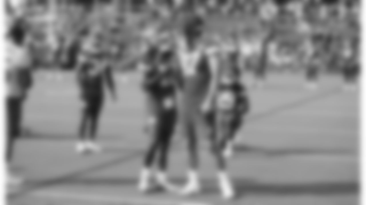 Kansas City Chiefs running back Isiah Pacheco (10) and tight end Travis Kelce (87) shake hands during training camp on day 1 of practice, Tuesday July 22, 2025