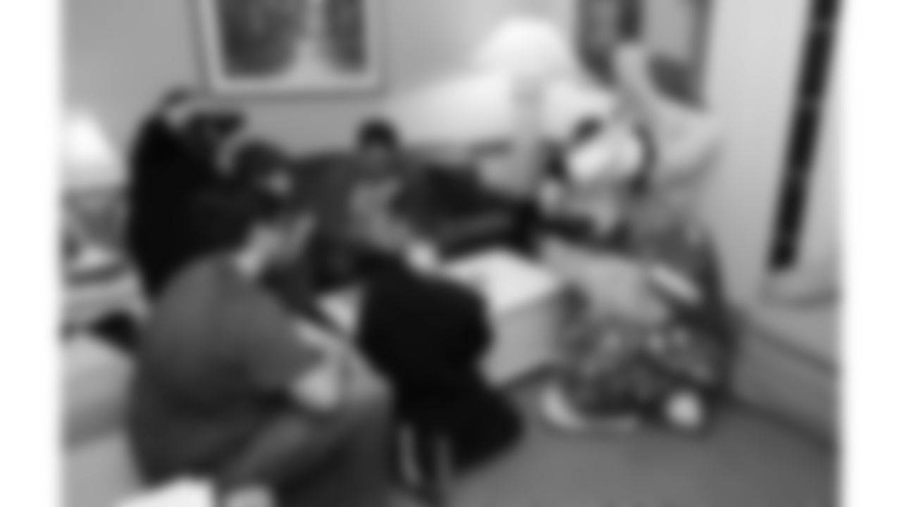 KC Wolf plays games with kids before the reveal of cornerback Trent McDuffies (22) My Cause My Cleats at the Solace House in Shawnee Mission, Kansas on Tuesday, November 11, 2025.