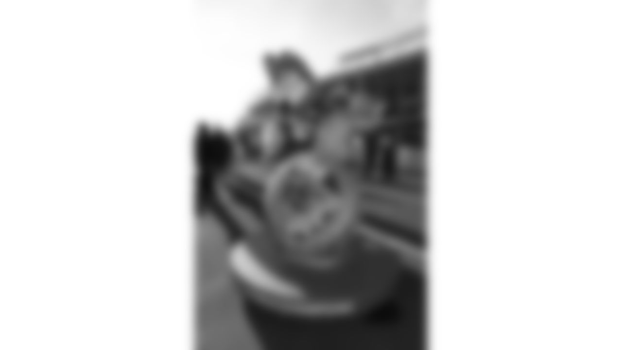 KC Wolf poses with fans in the Ford Tailgate District prior to a week 15 NFL Football game against the Los Angeles Chargers on Sunday, December 14, 2025 in Kansas City, MO.