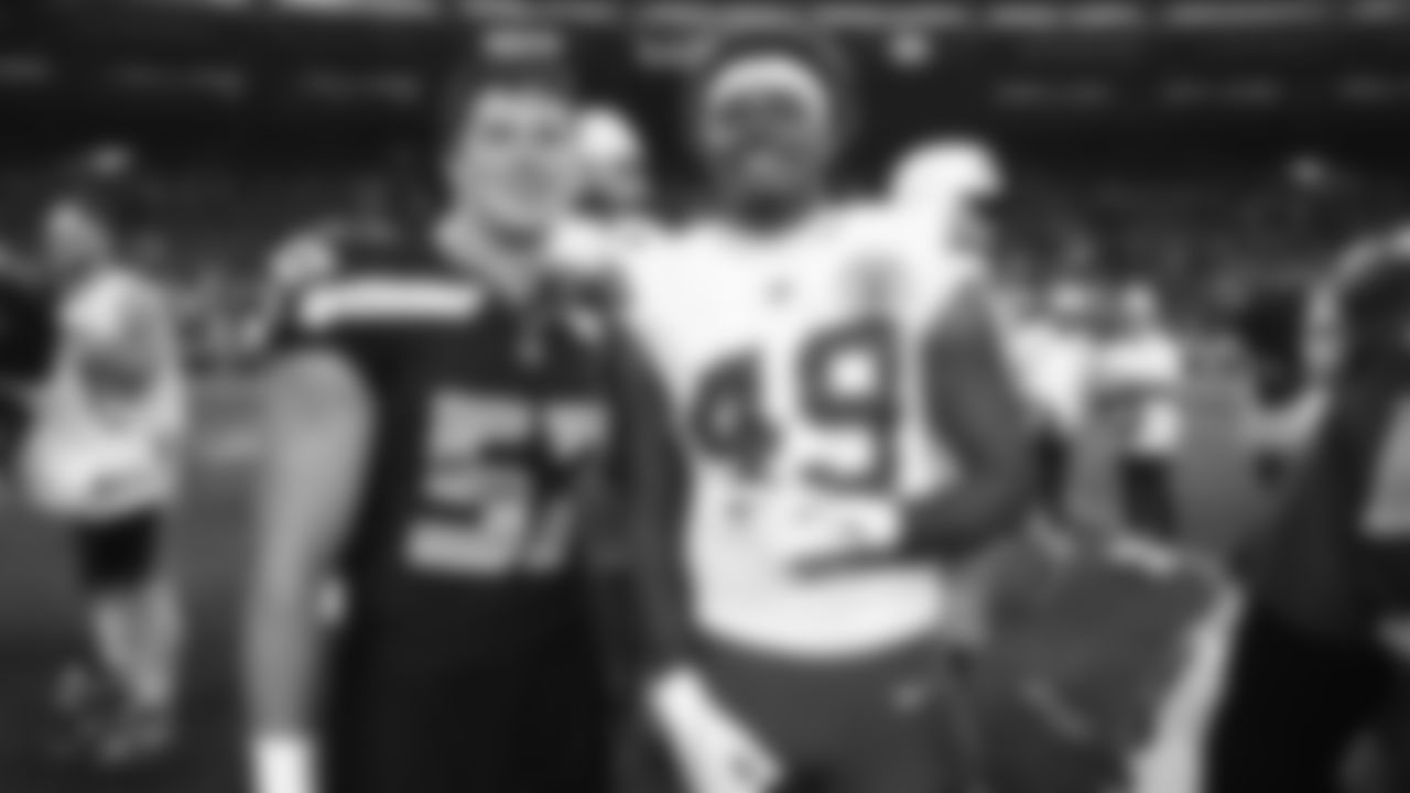 Kansas City Chiefs tight end Tre Watson (49) poses for a photo with Seattle Seahawks linebacker Connor O'Toole (57) following a preseason week 2 NFL football game, Friday, August 15, 2025 in Seattle, WA.
