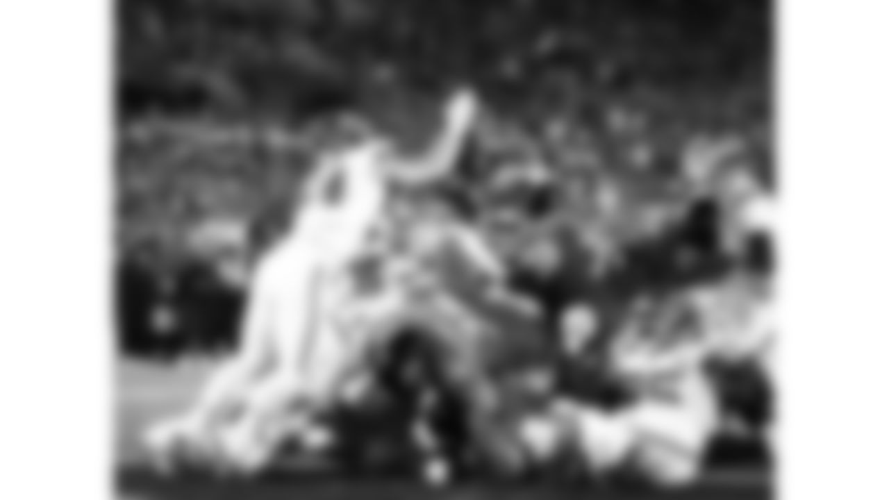 Kansas City Chiefs linebacker Nick Bolton (32) forces a fumble by Jacksonville Jaguars quarterback Trevor Lawrence (16) during the week 5 NFL football game, Monday, October 6, 2025 in Jacksonville, FL.