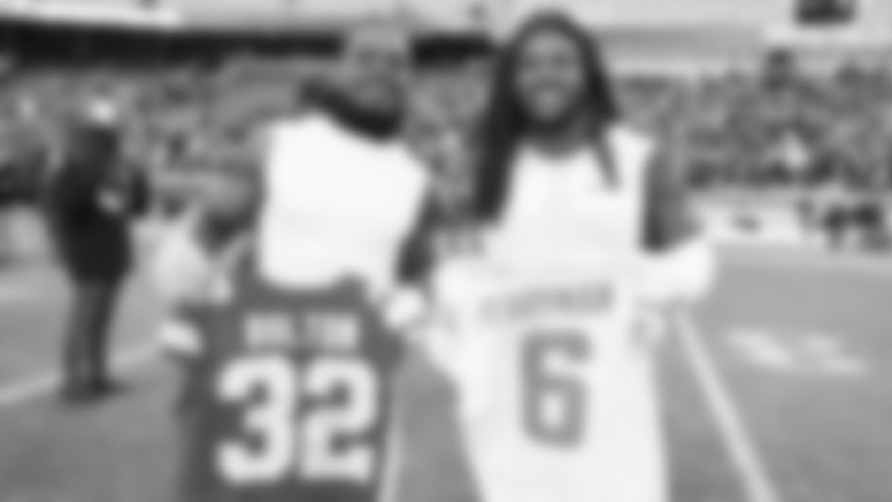 Kansas City Chiefs linebacker Nick Bolton (32) and San Diego Chargers linebacker Denzel Perryman (6) swap jerseys after an NFL week 15 matchup against the Los Angeles Chargers, Sunday December 14, 2025.