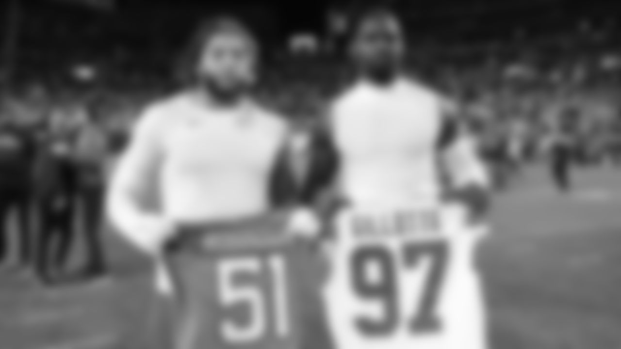 Kansas City Chiefs defensive end Ashton Gillotte (97) and Broncos outside linebacker Que Robinson (51) after a week 11 NFL Football game against the Denver Broncos on Sunday, November 16, 2025 in Denver, Colorado.