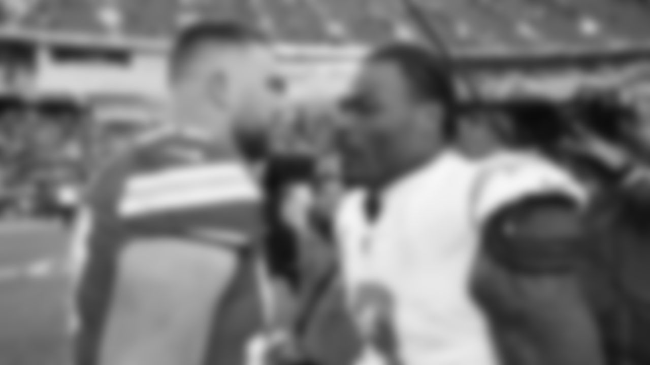 Kansas City Chiefs tight end Travis Kelce (87) talks with San Diego Chargers defensive back Derwin James Jr. (3) after an NFL week 15 matchup against the Los Angeles Chargers, Sunday December 14, 2025.