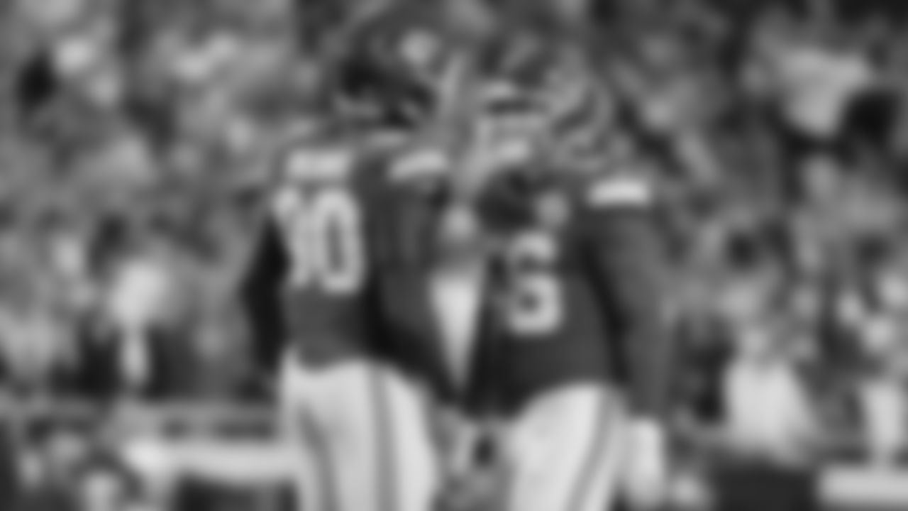 Defensive end Charles Omenihu (90) talks with Kansas City Chiefs defensive end George Karlaftis (56) during a week 8 NFL Football game against the Washington Commanders on Monday, October 27, 2025 in Kansas City, MO.