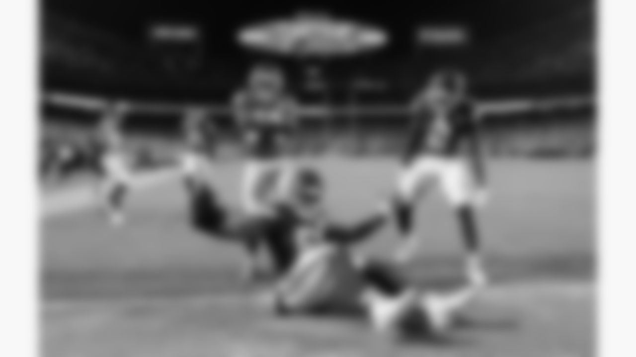 Kansas City Chiefs cornerbacks Jaylen Watson (35), Trent McDuffie (22) andJoshua Williams (2) celebrate an interception by defensive end Mike Danna (51) during a week 8 NFL Football game against the Washington Commanders on Monday, October 27, 2025 in Kansas City, MO.