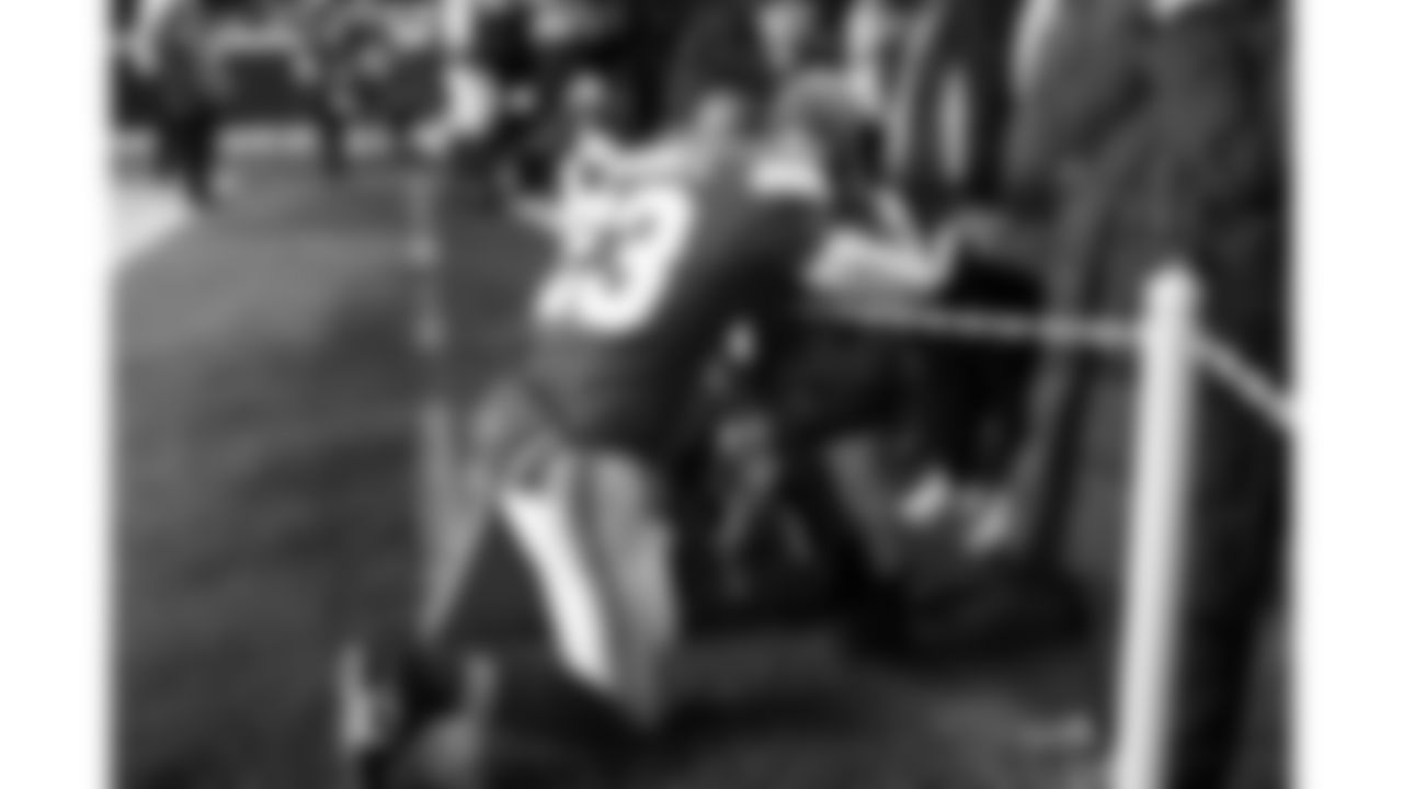 Kansas City Chiefs middle linebacker Drue Tranquill (23) hugs his son on the sideline prior to a week 14 NFL football game against the Houston Texans, Sunday, December 7, 2025 in Kansas City, MO.