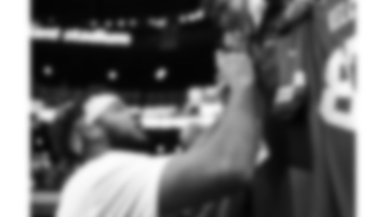 Kansas City Chiefs defensive back Jaden Hicks (21) signs fan merchandise prior to a week 18 game against the Las Vegas Raiders on Sunday, January 3, 2026.