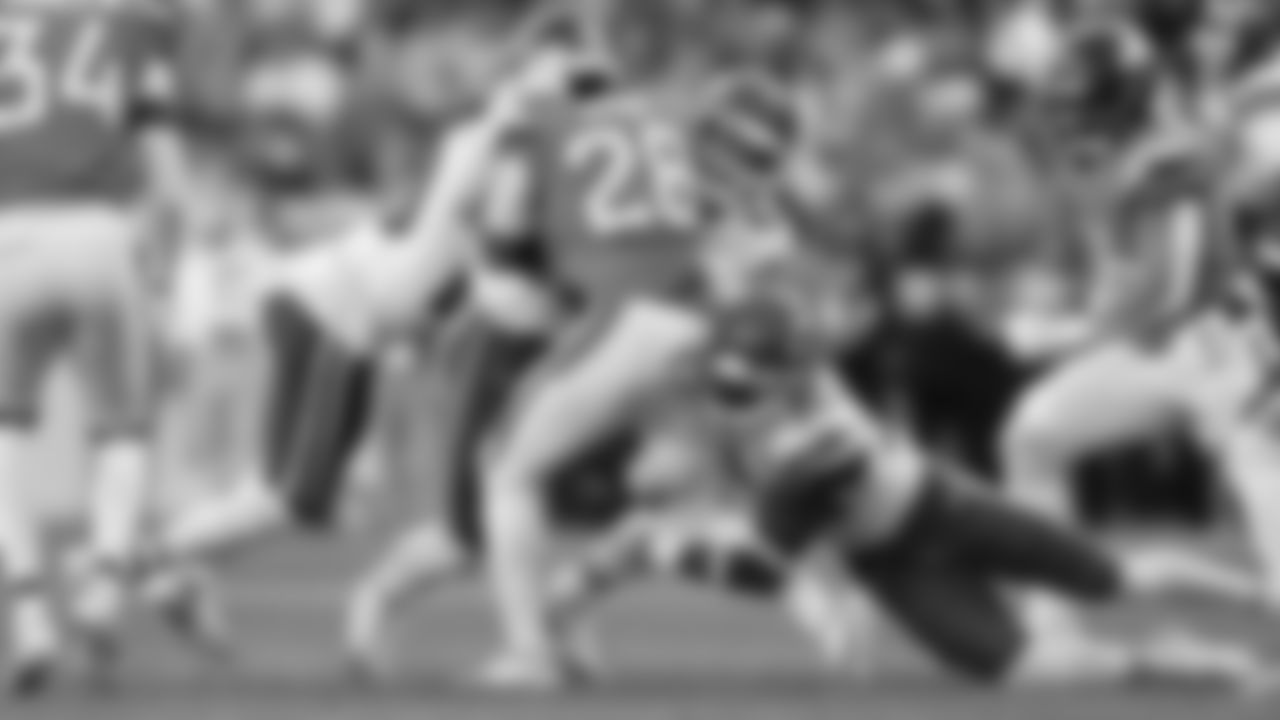 Kansas City Chiefs defensive back Nohl Williams (20), linebacker Jack Cochrane (43) and cornerback Chris Roland-Wallace (30) tackle Denver Broncos running back Tyler Badie (28) during a week 11 NFL football game, Sunday, November 16, 2025 in Denver, CO.