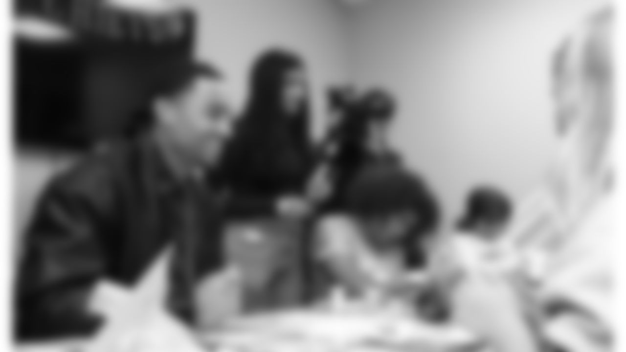 Kansas City Chiefs cornerback Trent McDuffies (22) decorates cookies with fans before his My Cause My Cleats reveal at the Solace House in Shawnee Mission, Kansas on Tuesday, November 11, 2025.