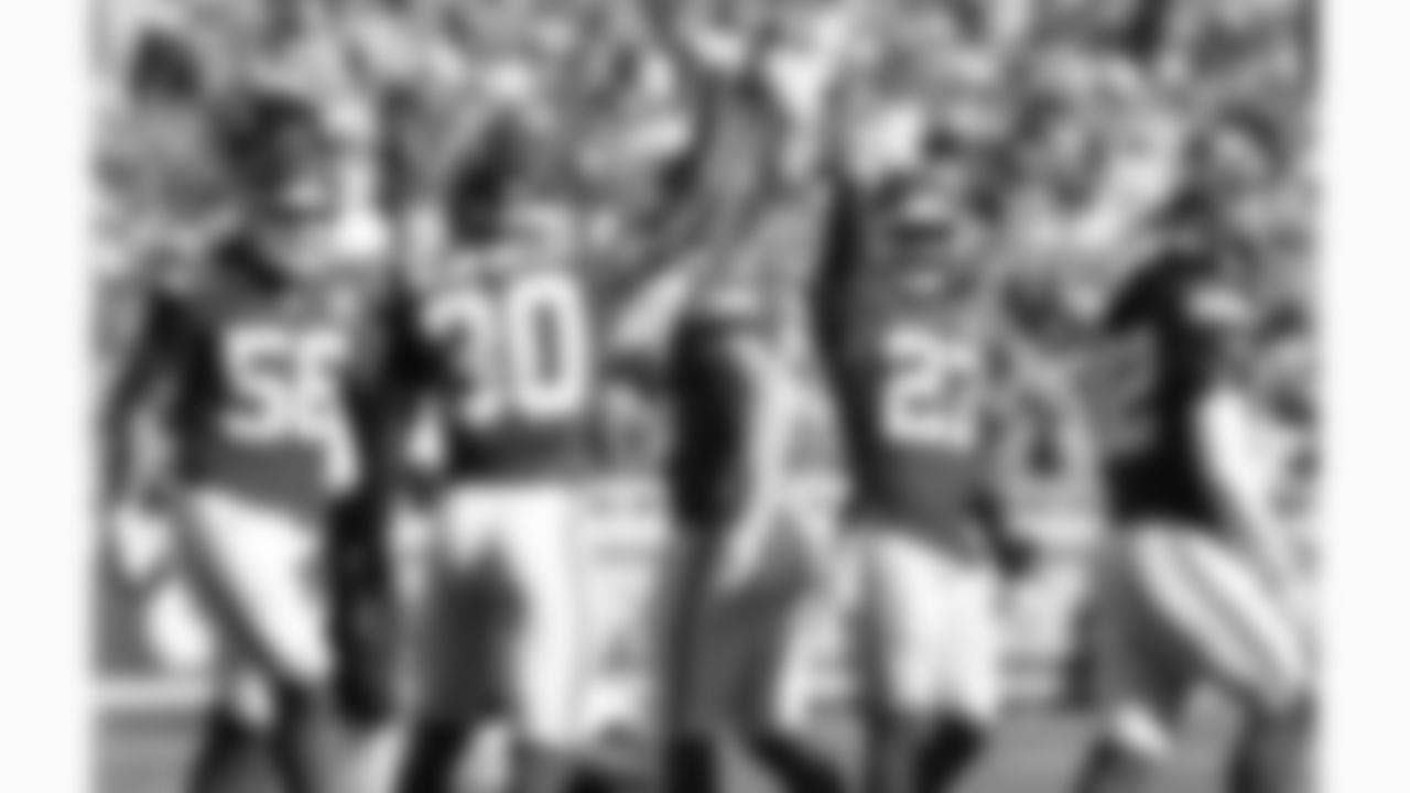 Kansas City Chiefs defensive end George Karlaftis (56), cornerback Chris Roland-Wallace (30) and defensive back Chamarri Conner (27) signal a stop during the week 4 NFL football game against the Baltimore Ravens, Sunday, September 28, 2025 in Kansas City, MO.
