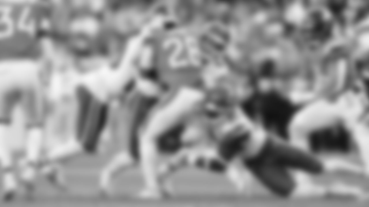 Kansas City Chiefs defensive back Nohl Williams (20), linebacker Jack Cochrane (43) and cornerback Chris Roland-Wallace (30) tackle Denver Broncos running back Tyler Badie (28) during a week 11 NFL football game, Sunday, November 16, 2025 in Denver, CO.