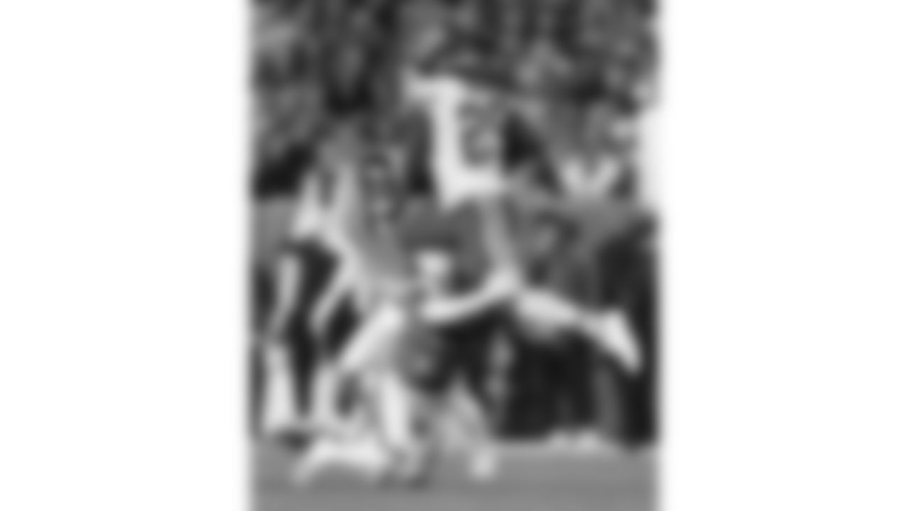 Kansas City Chiefs running back Kareem Hunt (29) hurdles Denver Broncos safety Brandon Jones (22) during a week 11 NFL football game, Sunday, November 16, 2025 in Denver, CO.