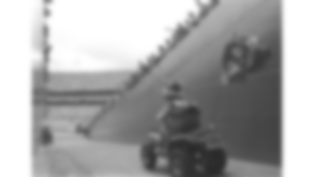 KC Wolf rides the 4-wheeler out of the tunnel on to the field during a 1991 home game.