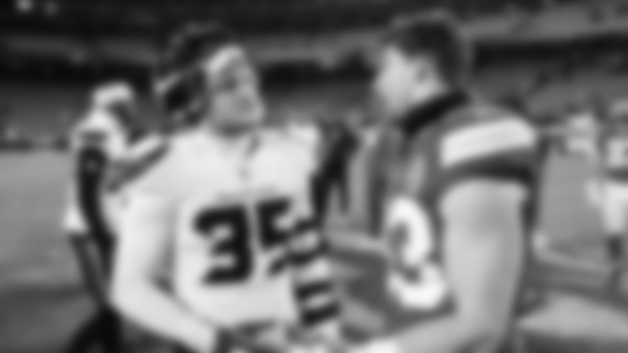 Kansas City Chiefs linebacker Jack Cochrane (43) talks with Houston Texans linebacker Jake Hansen (35) after an NFL week 14 matchup against the Houston Texans, Sunday December 7, 2025.