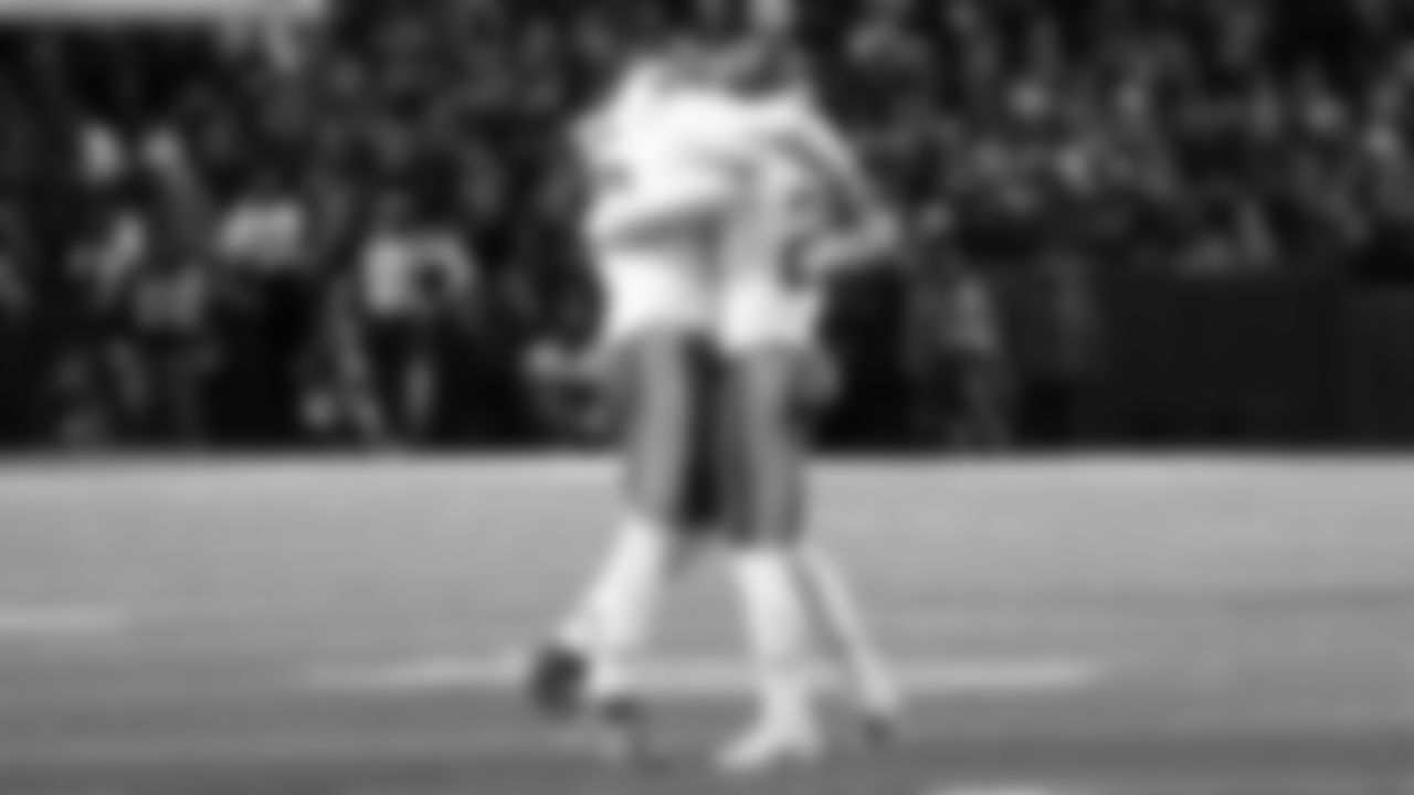 Kansas City Chiefs defensive end George Karlaftis (56) & safety Justin Reid (20) hug during the NFL Divisional Playoff football game against the Buffalo Bills on Sunday, January 21, 2024 in Buffalo.