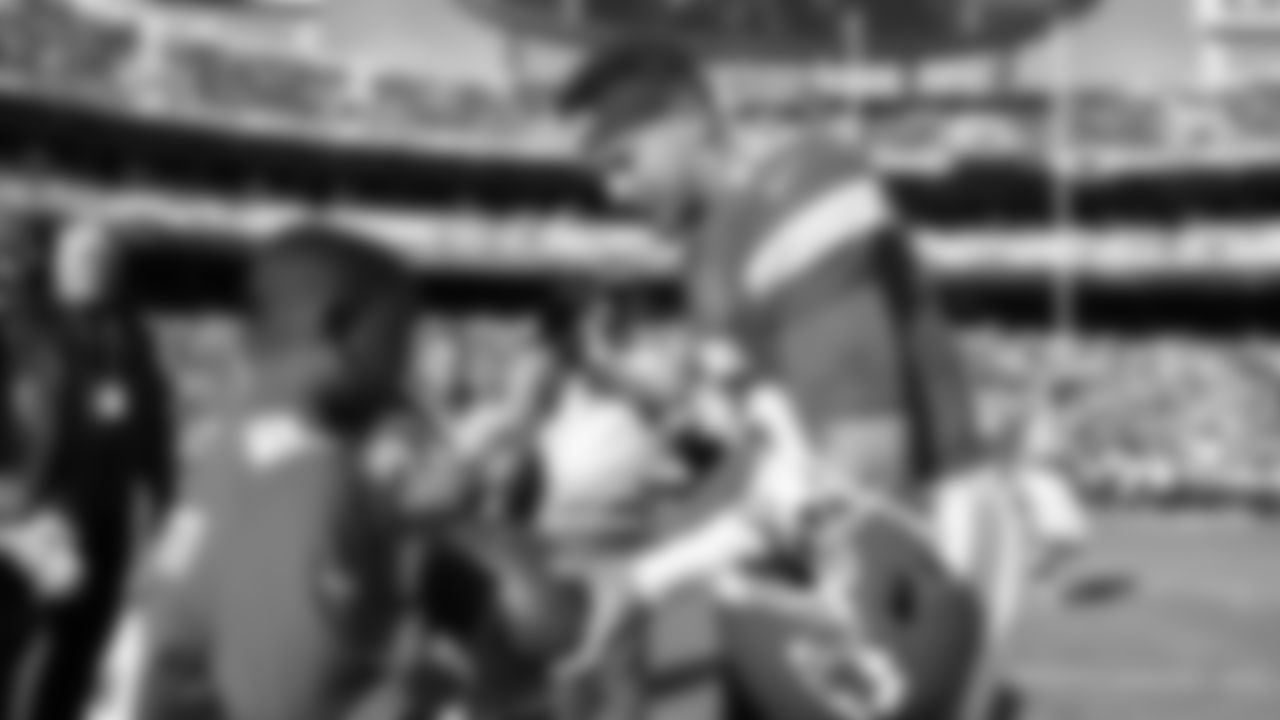 Kansas City Chiefs quarterback Patrick Mahomes (15) hands a game ball to fan prior to a week 12 NFL Football game against the Indianapolis Colts on Sunday, November 23, 2025 in Kansas City, MO