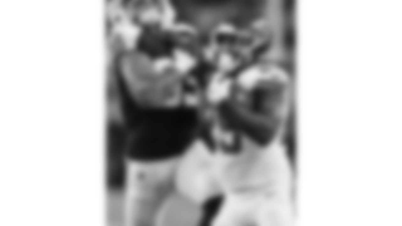 Kansas City Chiefs running back Kareem Hunt (29) pushes off a Cowboys defender during a week 13 NFL Football game against the Dallas Cowboys on Thursday, November 27, 2025 in Dallas, Texas.