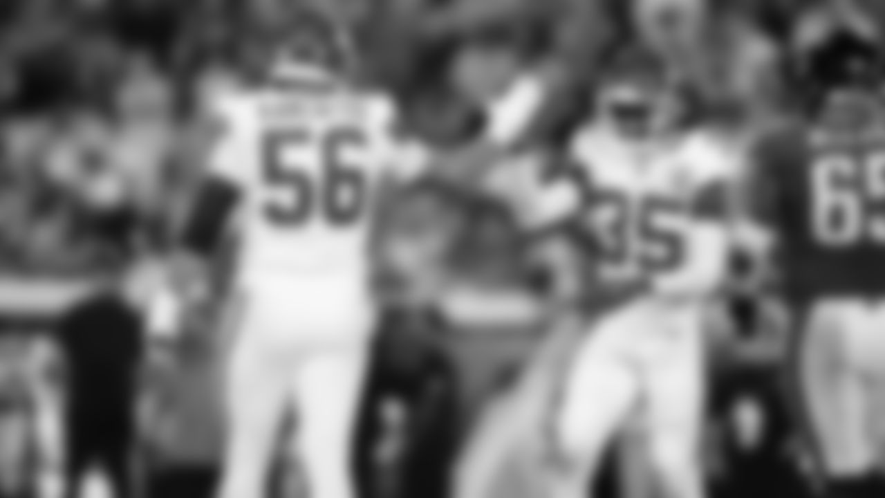 Kansas City Chiefs defensive end George Karlaftis (56) and Kansas City Chiefs cornerback Jaylen Watson (35) celebrate during a week 5 NFL football game against the Jacksonville Jaguars, Monday, October 6, 2025, in Jacksonville, FL.