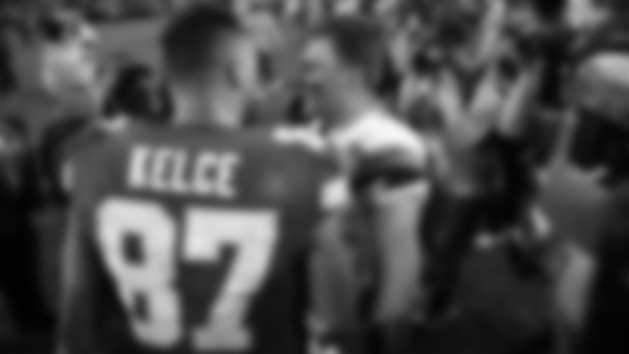 Kansas City Chiefs tight end Travis Kelce (87) talks with Denver Broncos quarterback Bo Nix (10) after an NFL week 17 matchup against the Denver Broncos, Thursday, December 25, 2025.