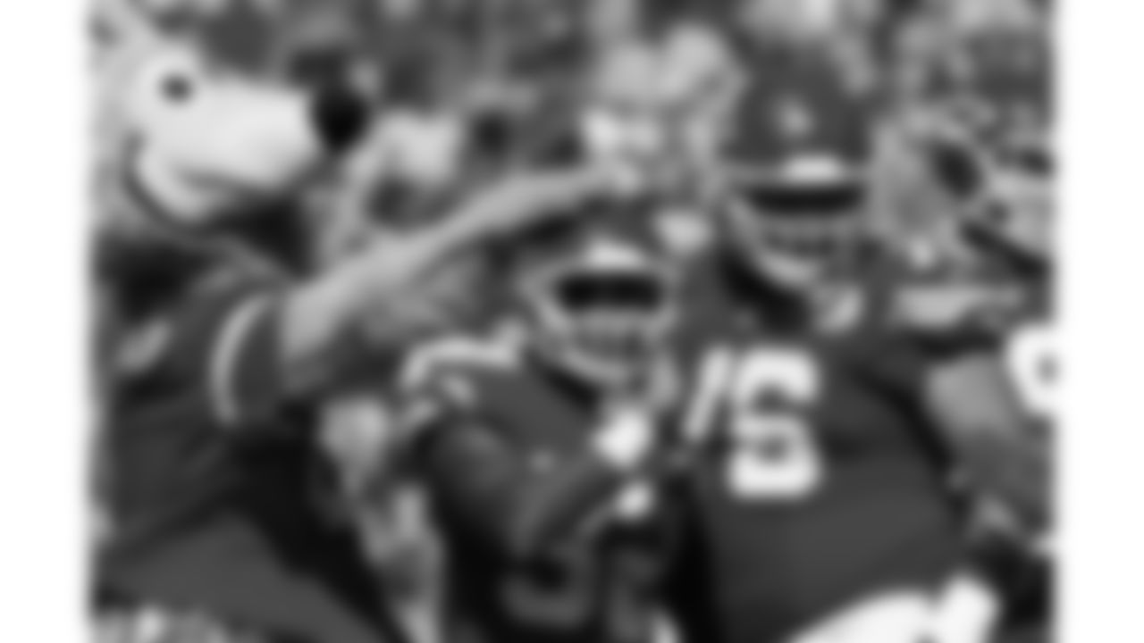 Kansas City Chiefs running back Spencer Ware (32) is congratulated by KC Wolf after scoring a touchdown during the game against the Seattle Seahawks, Saturday, August 13, 2016, in Kansas City, Missouri.