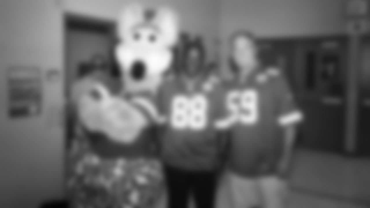 Kansas City Chiefs Alums and KC Wolf deliver flag football kits to local elementary schools in Lee's Summit, Missouri on September 16, 2019.