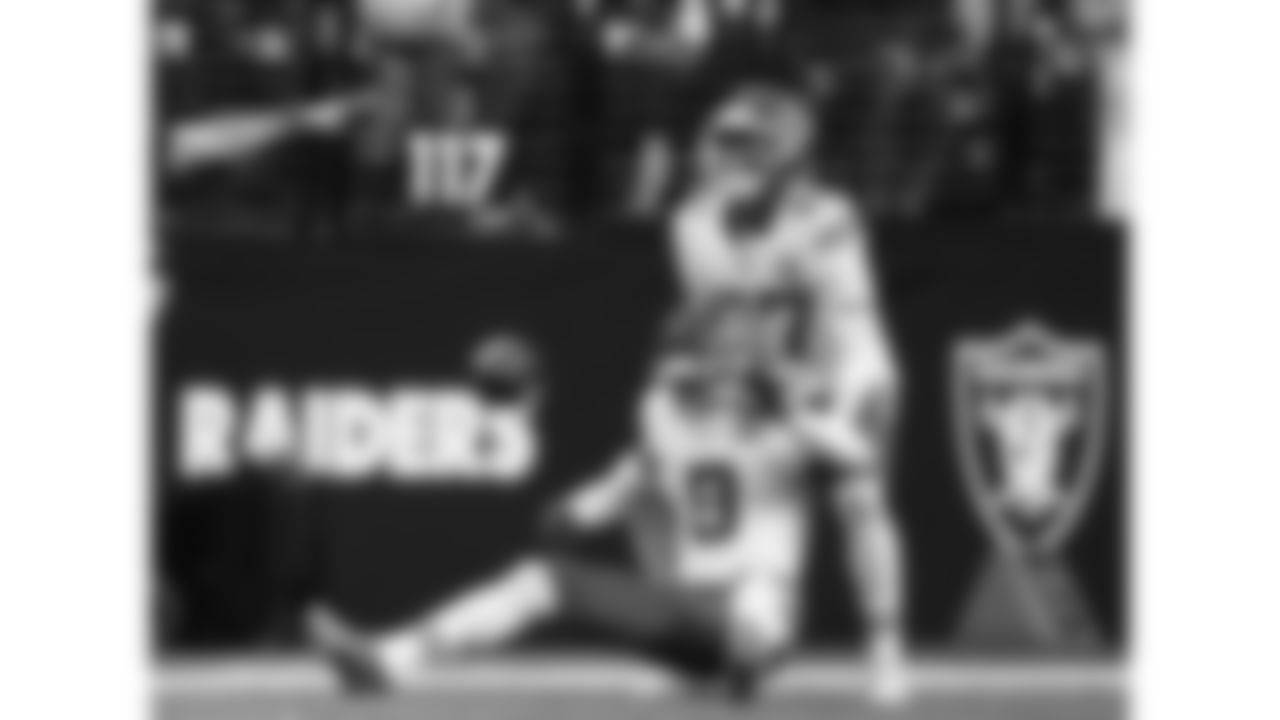 Kansas City Chiefs defensive back Chamarri Conner (27) helps cornerback Kristian Fulton (8) up during a week 18 NFL football game against the Las Vegas Raiders, Sunday, January 4, 2026 in Las Vegas, NV.