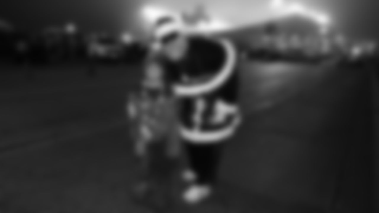 Santa and a fan prior to an NFL week 17 matchup against the Denver Broncos, Thursday, December 25, 2025.