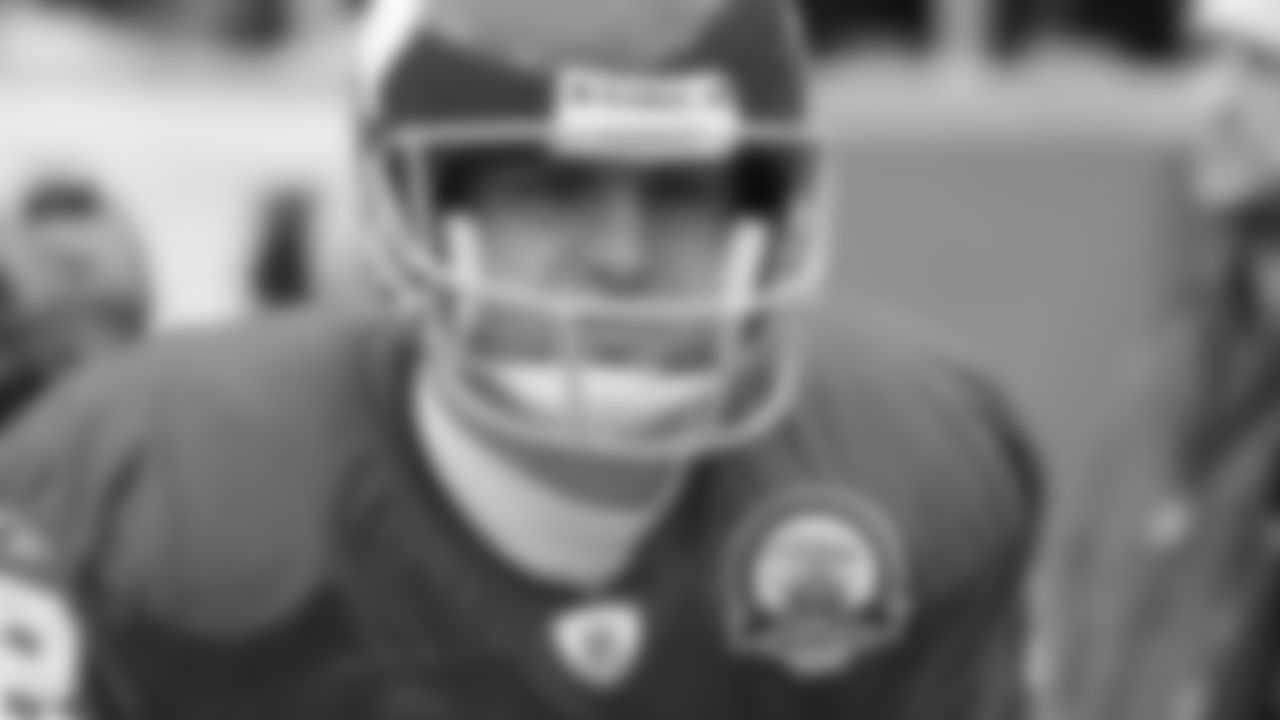 Kansas City Chiefs punter Dustin Colquitt (2) warms up on the sideline during a 2009 home game.