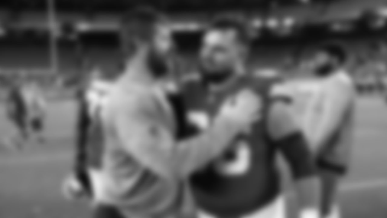 Kansas City Chiefs offensive lineman Michael Caliendo (66) and Chicago Bears offensive lineman Joe Thuney (62) hug after a preseason week 3 NFL football game against the Chicago Bears, Friday, August 22, 2025 in Kansas City, MO.