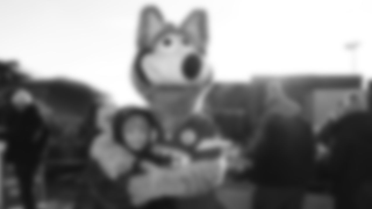 KC Wolf with a fan prior to an NFL week 15 matchup against the Los Angeles Chargers, Sunday December 14, 2025.