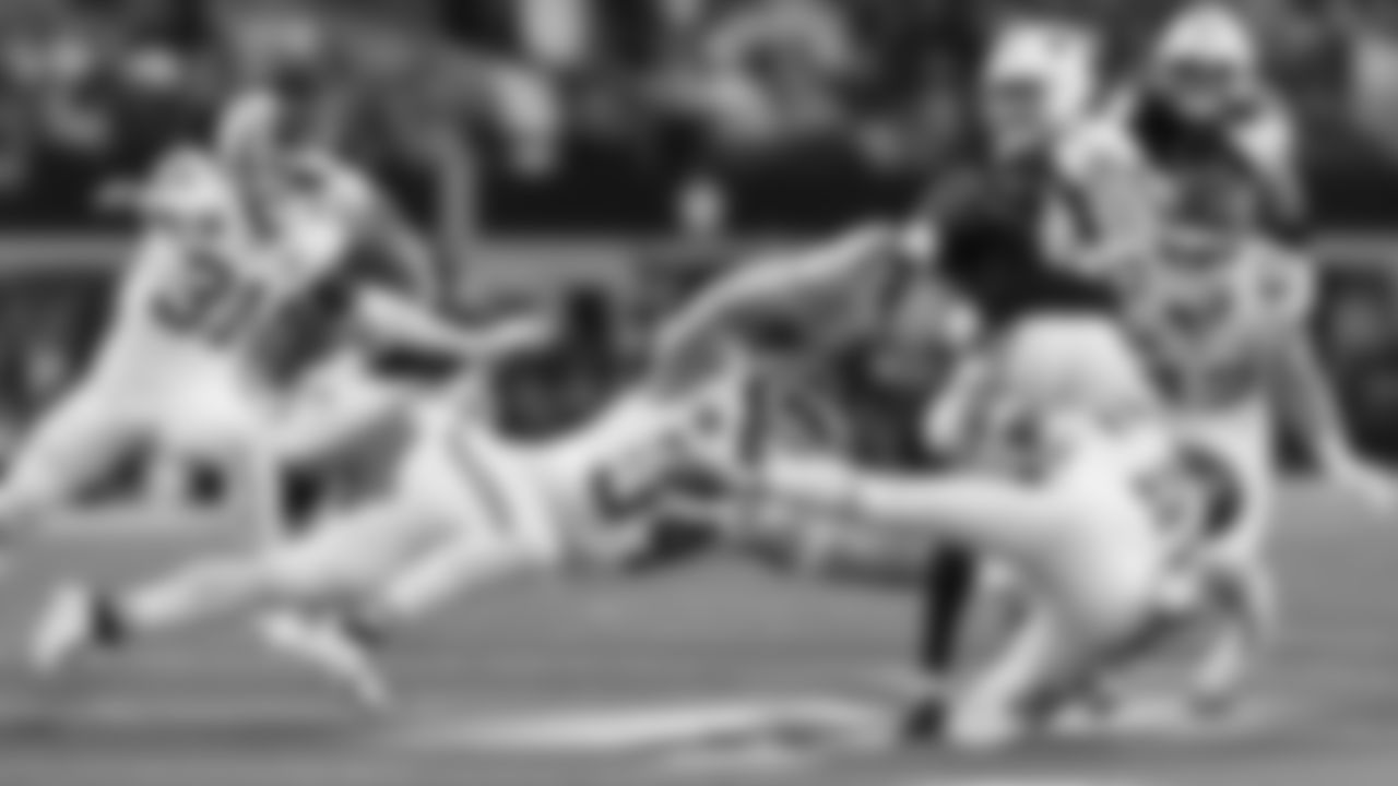 Kansas City Chiefs linebacker Leo Chenal (54), defensive back Jaden Hicks (21) and linebacker Jack Cochrane (43) attempt to tackle a Cowboys receiver during a week 13 NFL Football game against the Dallas Cowboys on Thursday, November 27, 2025 in Dallas, Texas.