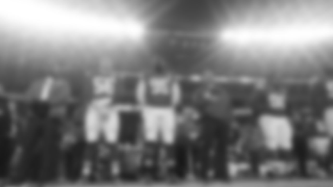 Defensive end George Karlaftis (56), defensive tackle Chris Jones (95), and Kansas City Chiefs defensive tackle Derrick Nnadi (92) during the National Anthem prior to an NFL week 14 matchup against the Houston Texans, Sunday December 7, 2025.
