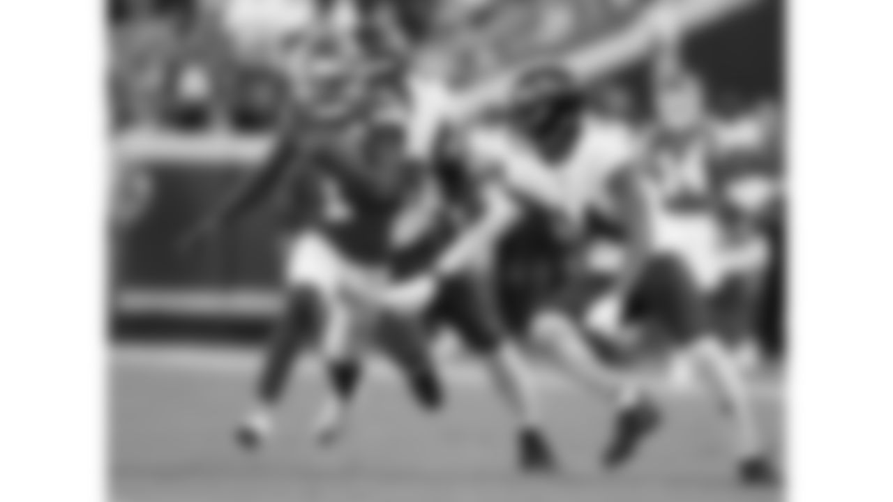 Kansas City Chiefs wide receiver Xavier Worthy (1) runs the ball in front of Baltimore Ravens linebacker Odafe Oweh (99) and safety Kyle Hamilton (14) during the week 4 NFL football game, Sunday, September 28, 2025 in Kansas City, MO.