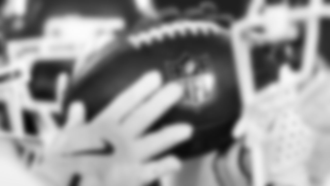 Kansas City Chiefs players hold a football prior to the week 3 NFL football game against the New York Giants, Sunday, September 21, 2025 in East Rutherford, NJ.