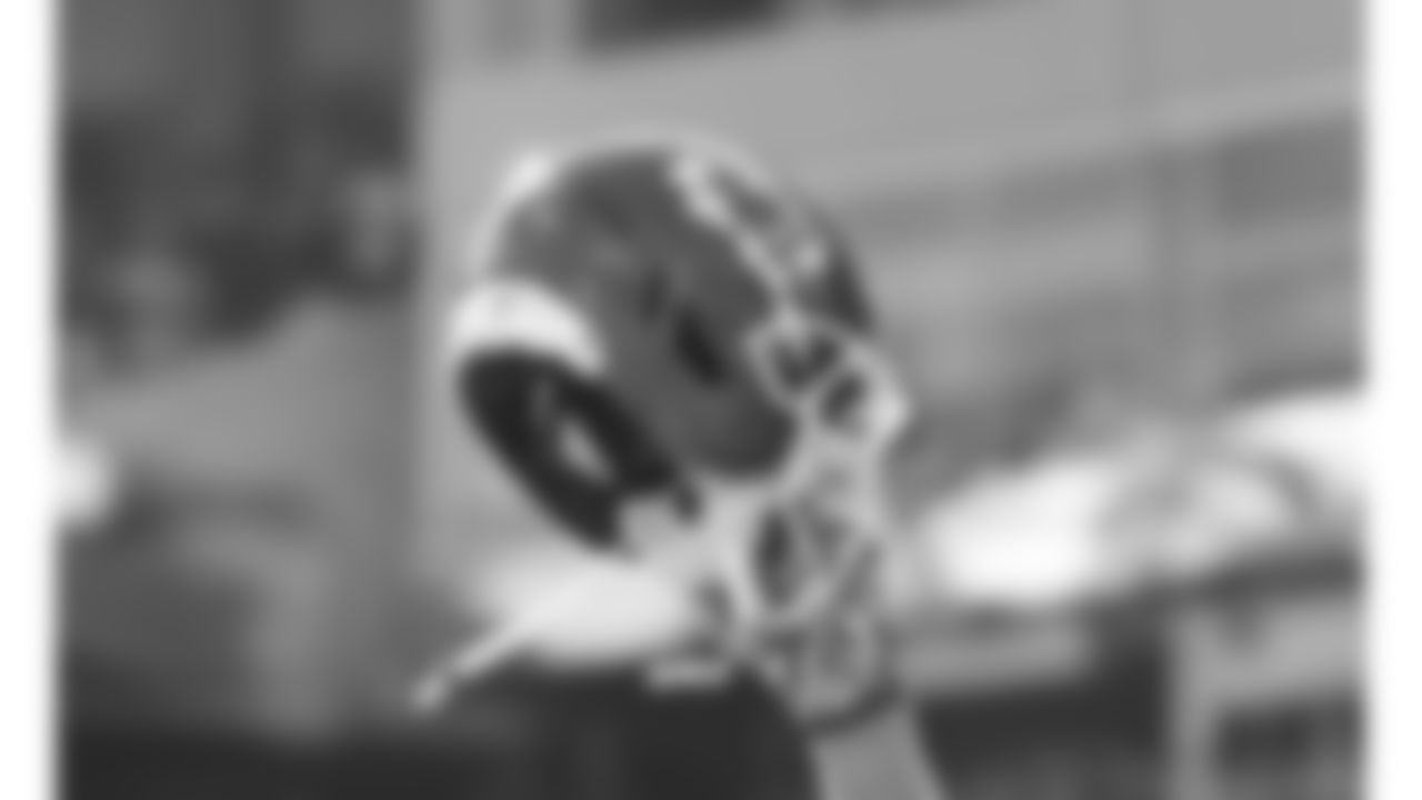 Kansas City Chiefs tight end Travis Kelce (87) lifts his helmet during the National Anthem prior to a week 15 NFL football game against the Los Angeles Chargers, Sunday, December 14, 2025 in Kansas City, MO.