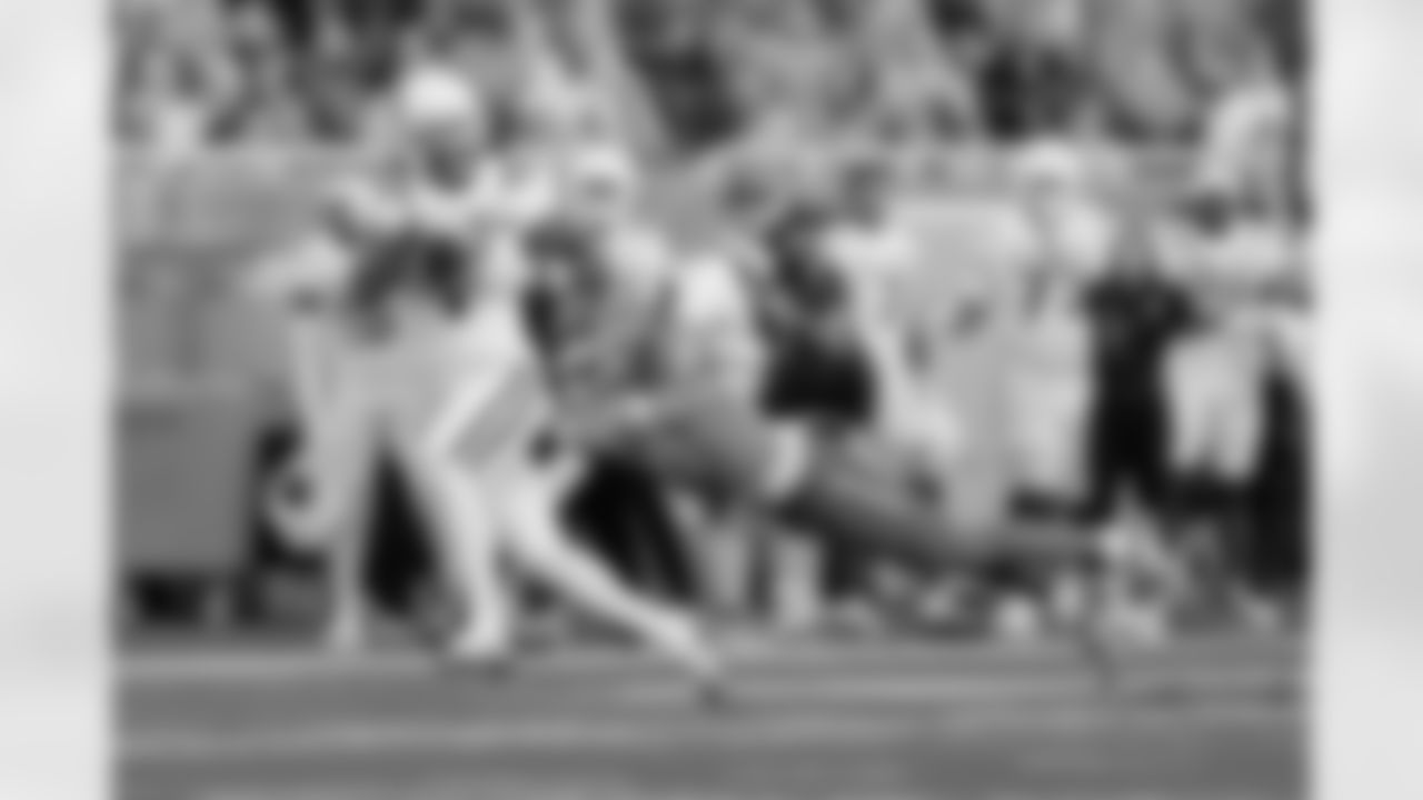 Utah State wide receiver Jalen Royals (1) runs through a diving tackle attempt by Boise State safety Ty Benefield (0) for a 59 yard touchdown reception in the first half of an NCAA college football game, Saturday, Oct. 5, 2024, in Boise, Idaho. . (AP Photo/Steve Conner)