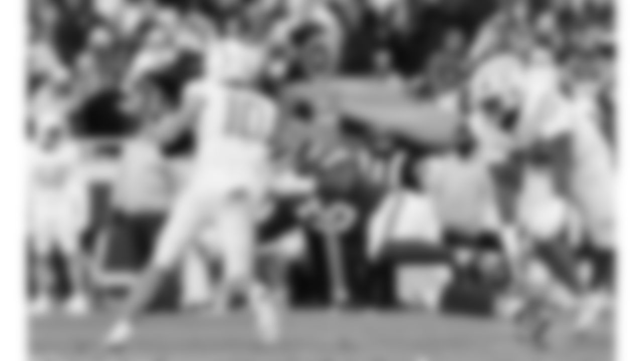 Kansas City Chiefs defensive end George Karlaftis (56) hits Los Angeles Chargers quarterback Justin Herbert (10) during a week 15 NFL football game, Sunday, December 14, 2025 in Kansas City, MO.