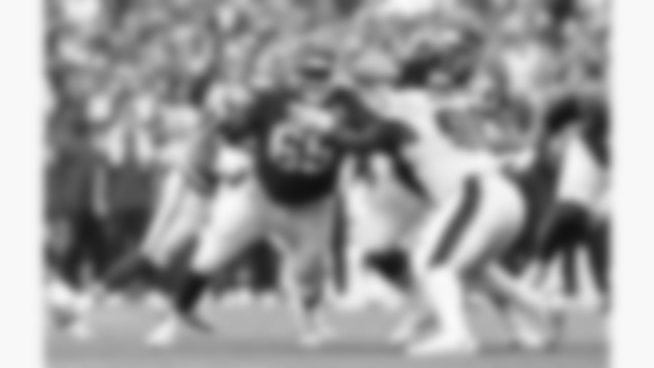 Kansas City Chiefs offensive lineman Trey Smith (65) and center Creed Humphrey (52) block Philadelphia Eagles defensive tackle Jalen Carter (98) during the week 2 NFL football game, Sunday, September 14, 2025 in Kansas City, MO.