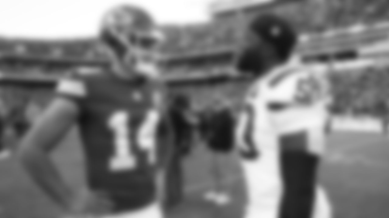 Kansas City Chiefs punter Matt Araiza (14) talks with Indianapolis Colts linebacker Segun Olubi (50) after a week 12 NFL Football game against the Indianapolis Colts on Sunday, November 23, 2025 in Kansas City, MO