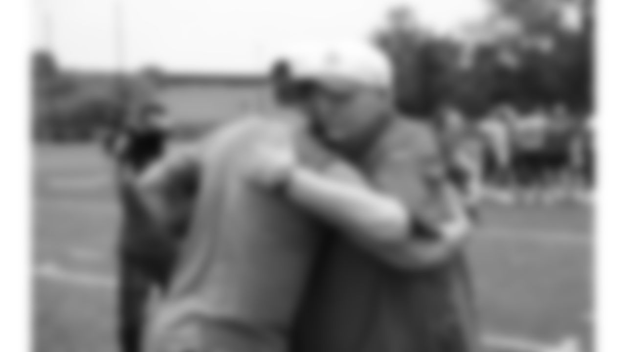 Former Kansas City Chiefs punter Dustin Colquitt hugs Head Coach Andy Reid during phase 3 of OTAs on Wednesday, June 4, 2025 in Kansas City, MO.