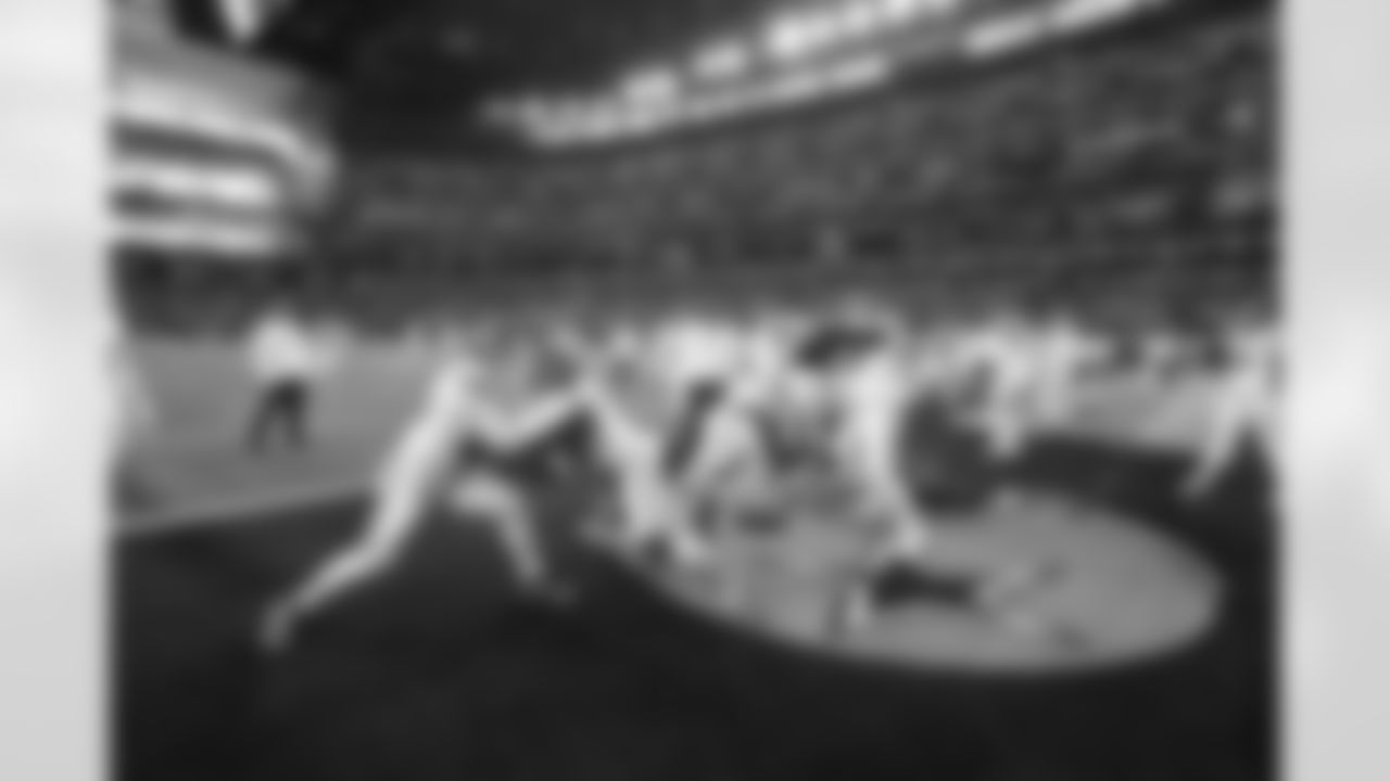 The offensive and defensive line warms up prior to a week 13 NFL football game against the Dallas Cowboys on Thursday, November 27, 2025 in Arlington, TX.